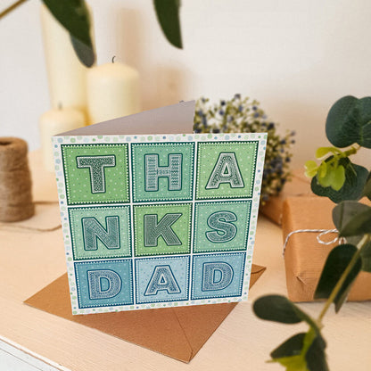 blue and green thanks dad typographic father's day card. Supplied with kraft brown recycled envelope