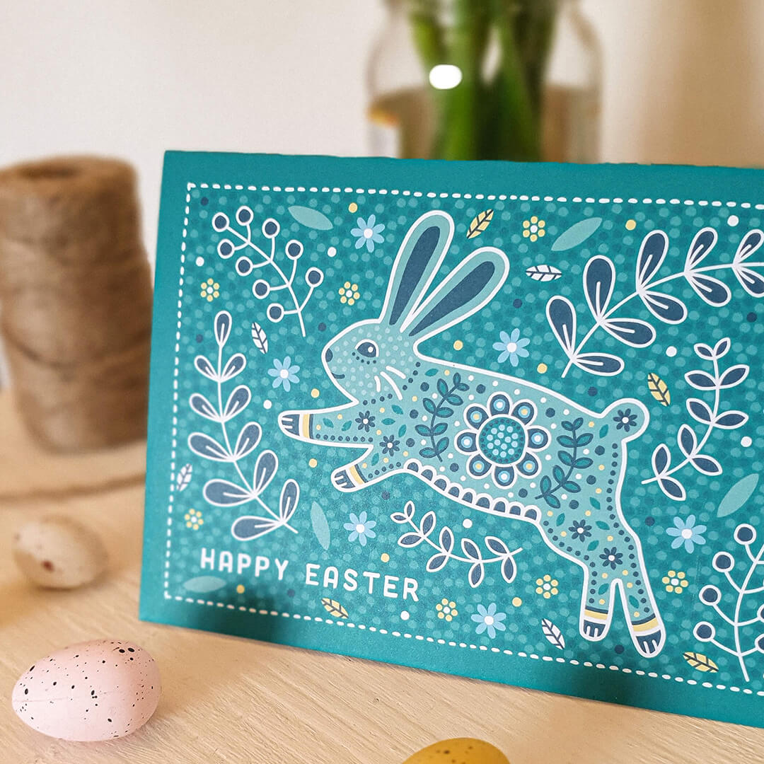 cute turquoise easter bunny card featuring floral and botanical illustrations and adorable easter bunny