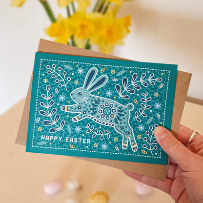 adorable easter bunny easter card on a turquoise background featuring botanical illustrations and supplied with a recycled kraft brown envelope