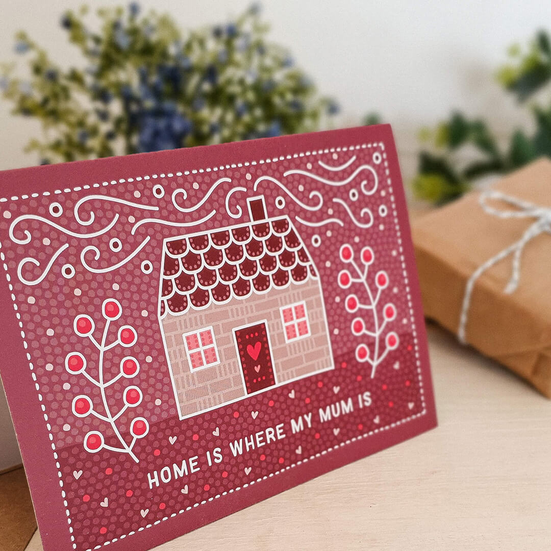 cute and sentimental mother's day card featuring pink house illustration and 'home is where my mum is' message. Supplied with a recycled kraft brown envelope.