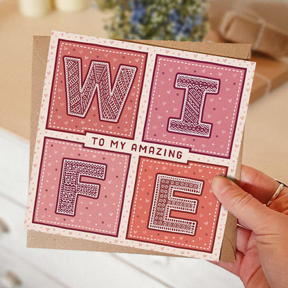 hand holding romantic valentines day card for wife Red and Pink to my amazing wife Valentines day card Printed on FSC-certified card with kraft brown recycled envelope Blank inside