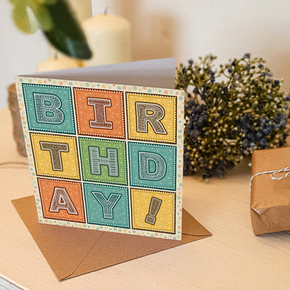 Turquoise orange and yellow typographic birthday card Part of the unique colourful typographic birthday card multipack Printed on FSC-certified card with kraft brown recycled envelopes Blank inside