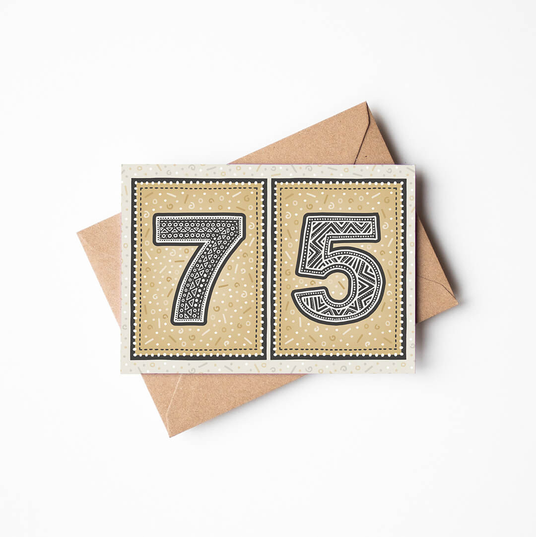 75th birthday card with a gold background and a recycled brown envelope.