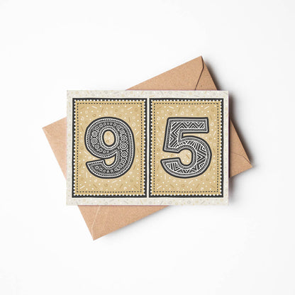95th birthday card with a gold background and a recycled brown envelope.